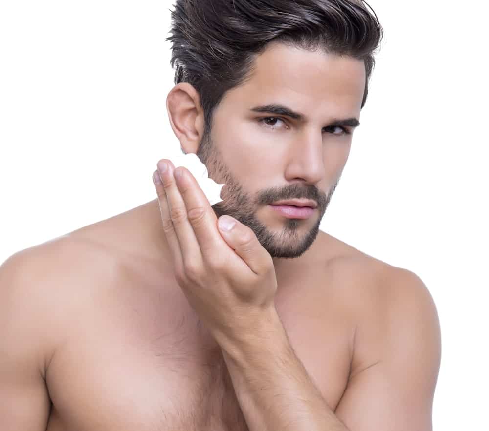 Man applying beard wash.