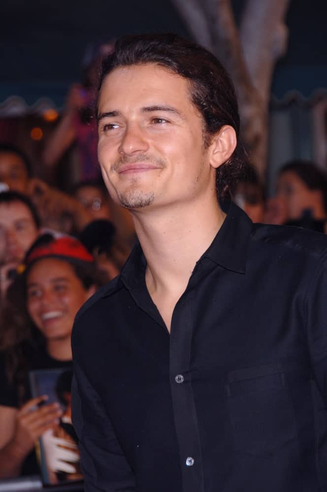 Actor ORLANDO BLOOM was seen with a gorgeous low man-bun at the world premiere of his new movie "Pirates of the Caribbean: Dead Man's Chest" at Disneyland, CA on June 24, 2006.