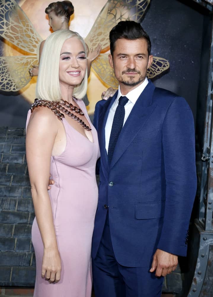 Katy Perry with Orlando Bloom at the Los Angeles premiere of Amazon's 'Carnival Row' held on August 21, 2019. Katy wore a blush dress complemented with her usual straight blonde tresses.