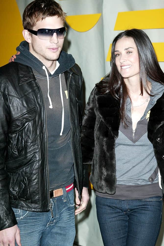 Ashton Kutcher and Demi Moore were at Rebel Yell Clothing Launch Party in Kitson, Los Angeles on February 19, 2006. They were both in casual winter outfits with Kutcher wearing cool sunglasses and a tousled Caesar hairstyle.