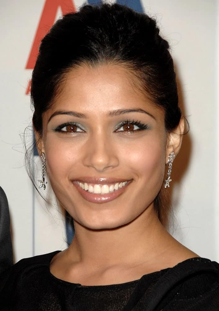 Freida Pinto's thick black hair was styled into this semi-messy updo for the 2009 BAFTA/LA Britannia Awards, Hyatt Regency Century Plaza in Los Angeles last November 5, 2009.