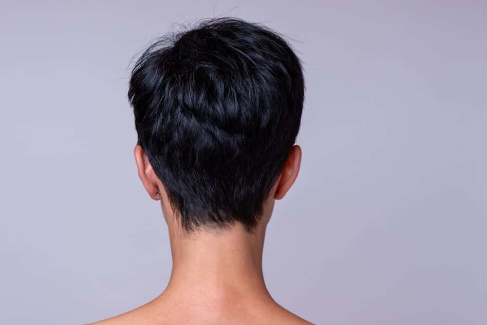 A woman with a boy cut hairstyle as seen from behind.