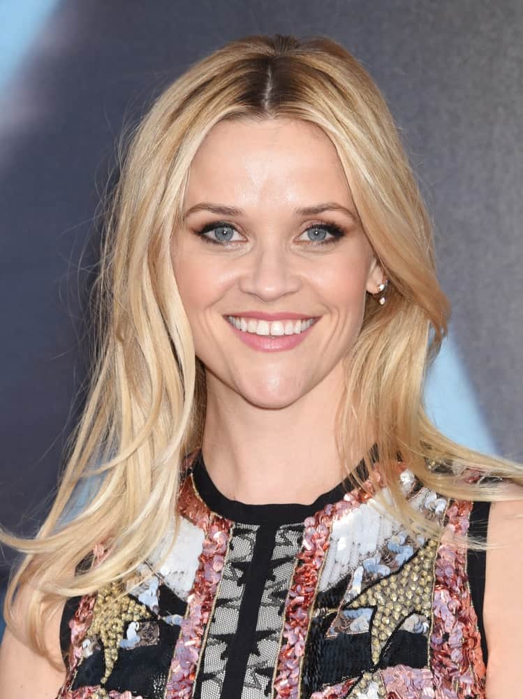 Reese Witherspoon attended the "Sing" World Premiere on December 3, 2016 in Los Angeles, CA. She wore a colorful dress to go with her simple tousled and loose blond hairstyle with layers and subtle highlights.