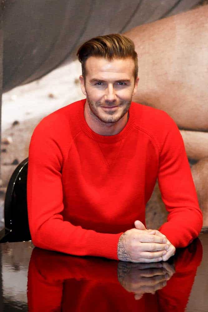 David Beckham looked stylish with a pompadour hairstyle featuring extra short sides with elongated back-swept top during the launch of his Bodywear range at the H&M Super Bowl Event on February 1, 2014 in New York City.