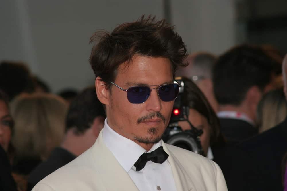 Johnny Depp attended the Tim Burton Golden Lion For Lifetime Achievement Award in Venice during the 64th Venice Film Festival last September 5, 2007 wearing an elegant white tuxedo and his short hair was tossed in a slight pompadour look.