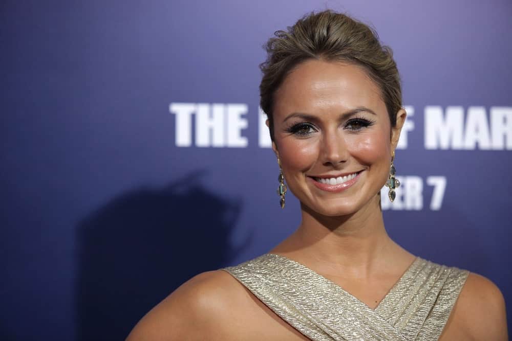 The actress exhibited a classy look showcasing a volumized updo hairstyle that accentuates her gorgeous earrings. This was worn at the "The Ides of March" Los Angeles Premiere on September 27, 2011.