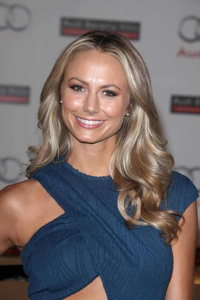 The actress exhibits her feminine side by flaunting her soft and gorgeous waves as she arrives at the Grand Opening Of Audi Beverly Hills Dealership, March 8, 2012.