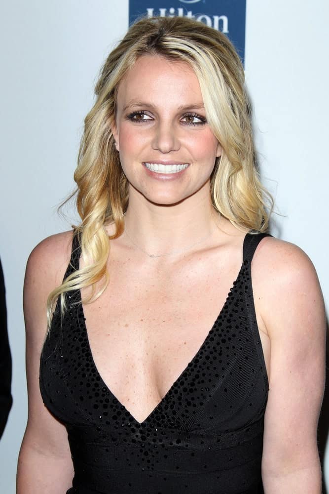 The singer styled her hair with spiral curls as she attends the Pre-Grammy Party hosted by Clive Davis at the Beverly Hilton Hotel on February 11, 2012