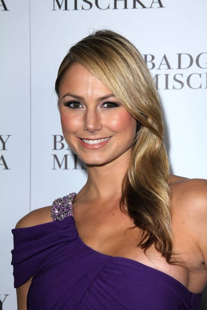 The actress arrives for the opening of the Badgley Mischka Flagship last  March 2, 2011, with a gorgeous halter dress and a loose blonde hair that's gathered on one side.