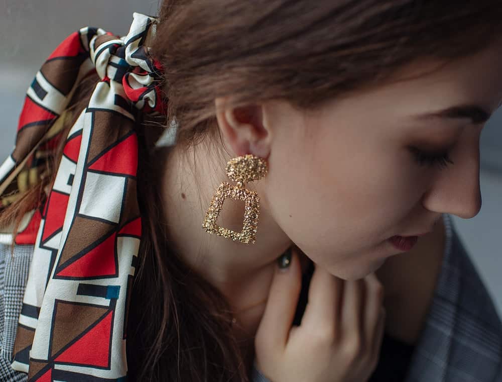 A woman wearing a bandana hair tie.