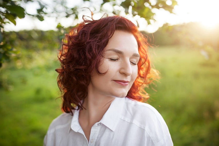 dark copper brown curly hair