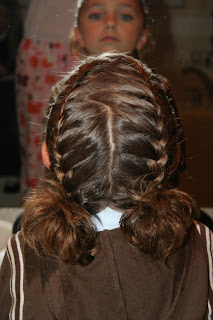 Back view of young girl modeling "Double-French Braids w/Messy Flips"