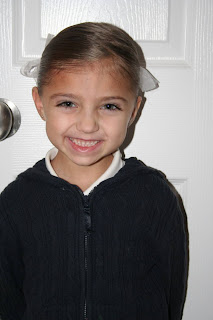 Portrait of young girl modeling "Y" braid hairstyle