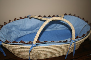 Blue and natural straw Moses basket