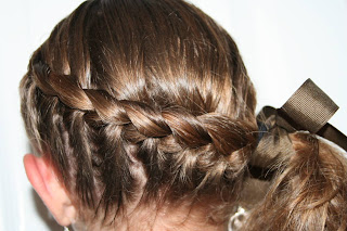 Back view of young girl modeling "Wrap-Around French Braid" hairstyle