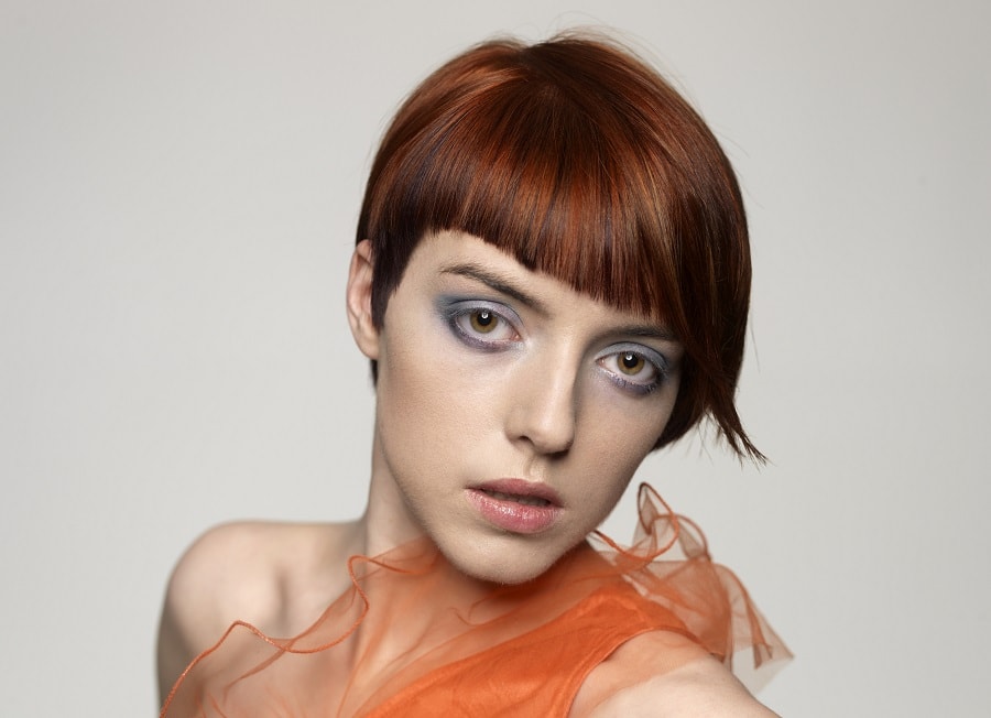 asymmetrical bob with short auburn brown hair