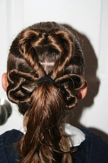 Back view of young girl modeling "Best Three-Leaf Clover" hairstyle