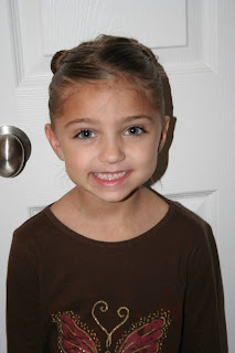 Portrait view of young girl modeling "Two-Leaf Clover" hairstyle