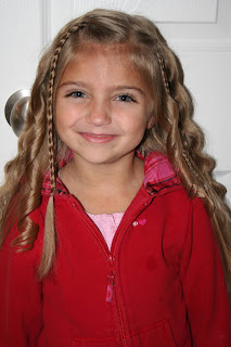 Portrait view of young girl modeling "Beachy Combo" hairstyle