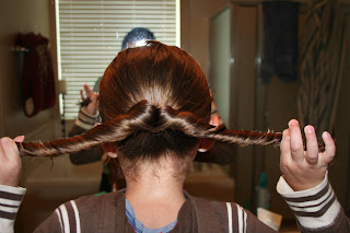 Young girl's hair being styled into "Pretzel-Twist Messy Bun"