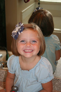 Portrait of young girl with A-Line Bob Haircut and bow in her hair