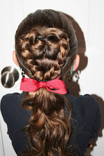 Back view of Young girl modeling "Flip Braided Heart" hairstyle