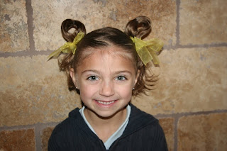 Portrait of young girl modeling Easter Hairstyles: Bunny-Ear Pigtails