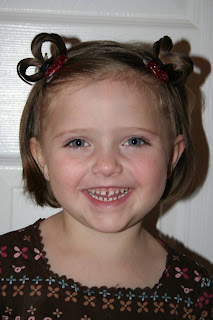 Portrait view of a young girl outside modeling “Heart Pigtail” hairstyle