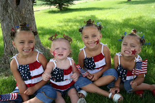 4 sisters modeling the "Holiday Twisty Buns" hairstyle outside 