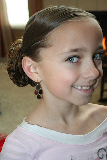 Side view of young girl modeling "bundled braids" hairstyle