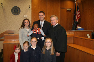 A photo of the whole family at the courthouse.