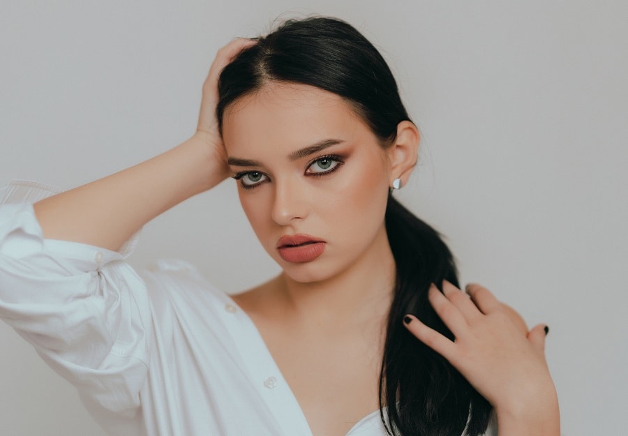 girl with black ponytail and blue eyes