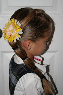 Side view of young girl modeling "Top-Knot with Banded" Ponytail