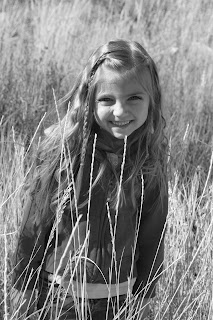 Portrait view of young girl modeling "Beachy Combo" hairstyle