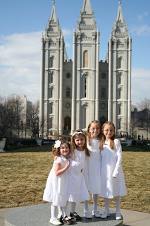 4 sisters posing in front of a church