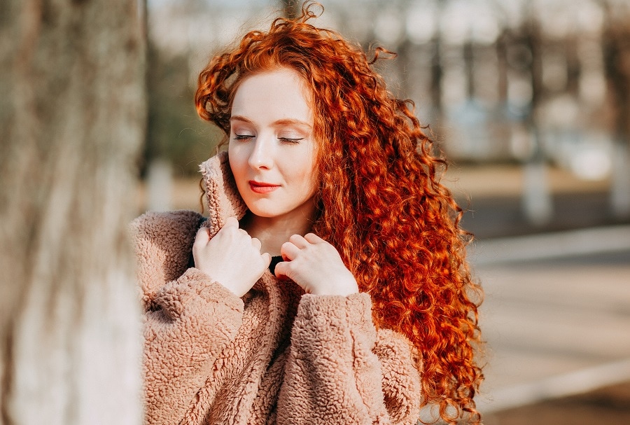 girl with curly long copper hair