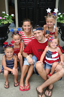 McKnight family picture - 4 sisters modeling the "Holiday Twisty Buns" hairstyle outside 