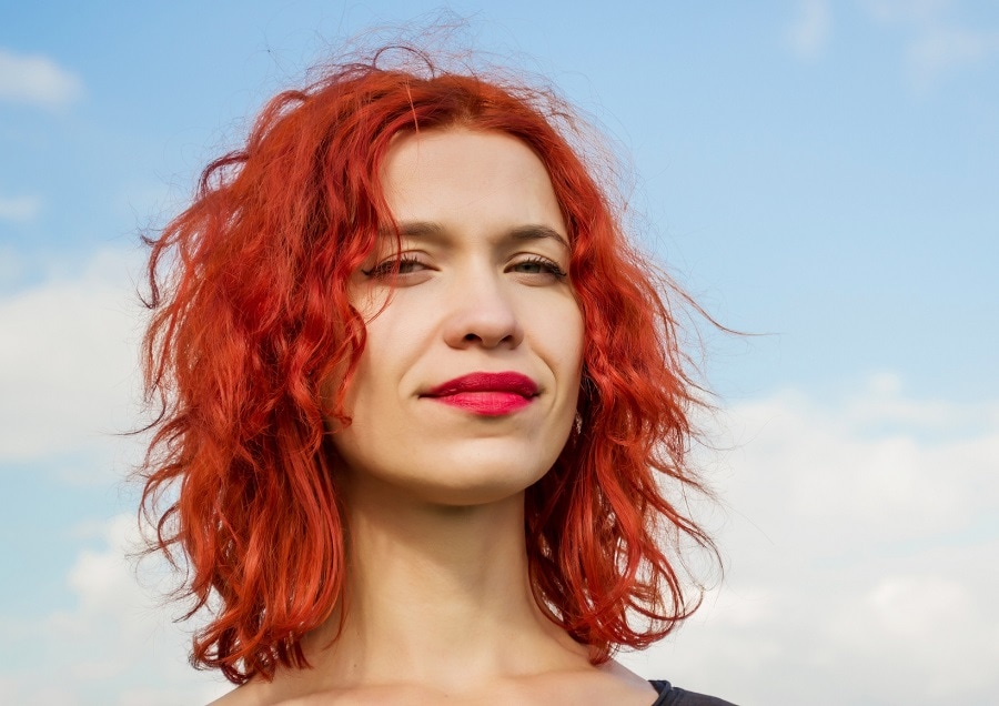 messy medium red bob cut