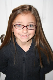 Portrait view of young girl modeling "teen heart" hairstyle 2