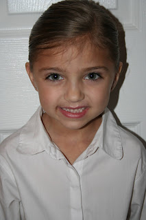 Portrait view of young girl modeling "Three-Leaf Clover Twists" hairstyle