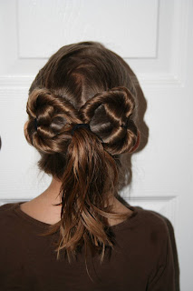 Back view of young girl modeling "Two-Leaf Clover" hairstyle