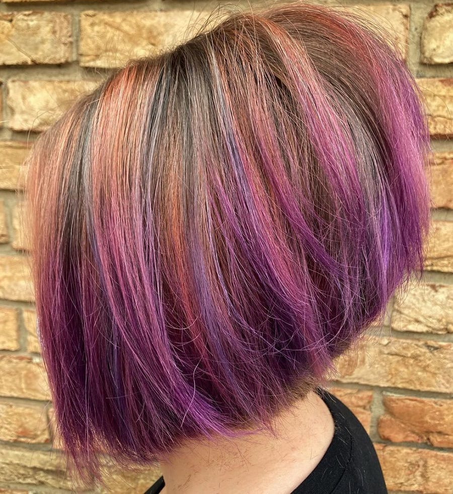 angled bob with pink and purple highlights