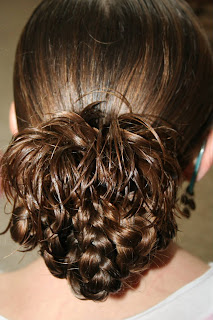 Back view of young girl modeling "bundled braids" hairstyle