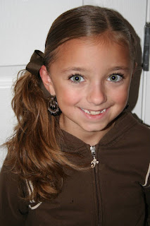 Portrait of young girl modeling "Wrap-Around French Braid" hairstyle