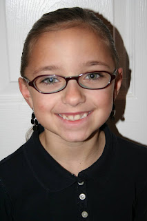 Portrait of Young girl modeling "Flip Braided Heart" hairstyle