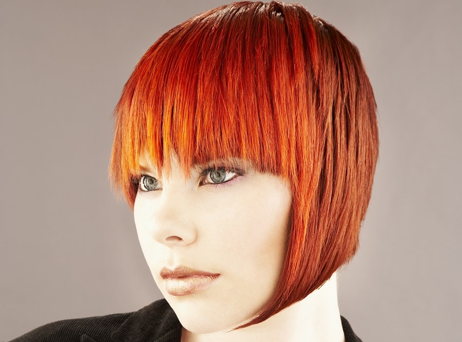 fiery red asymmetrical bob with bangs