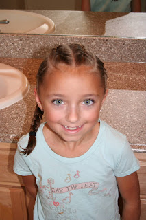 Portrait of girl's hair styled in "Criss-Cross French Braids"