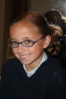 Portrait of young girl modeling "Ponytail Half Braid" hairstyle