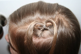 Top view of young girl modeling "teen heart" hairstyle 3