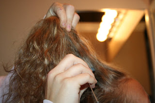 Young girl's 2nd Day Curls from Double-French Braids being styled